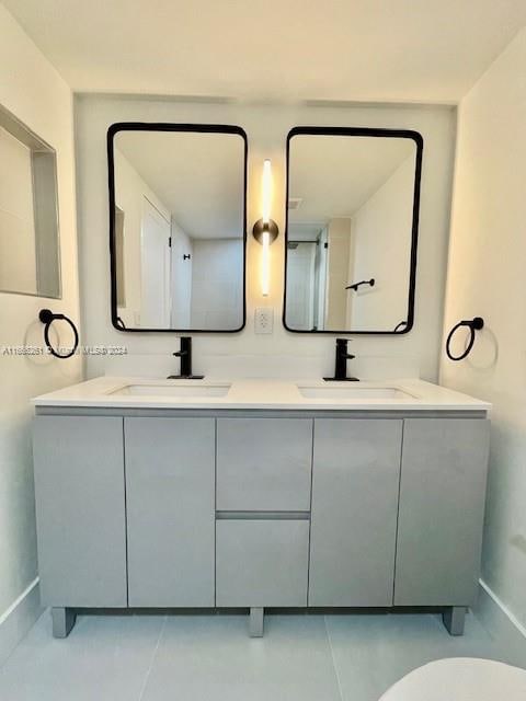 bathroom with vanity and tile patterned floors