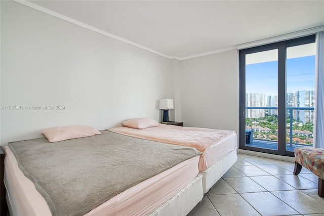 bedroom with a wall of windows, crown molding, and tile patterned floors