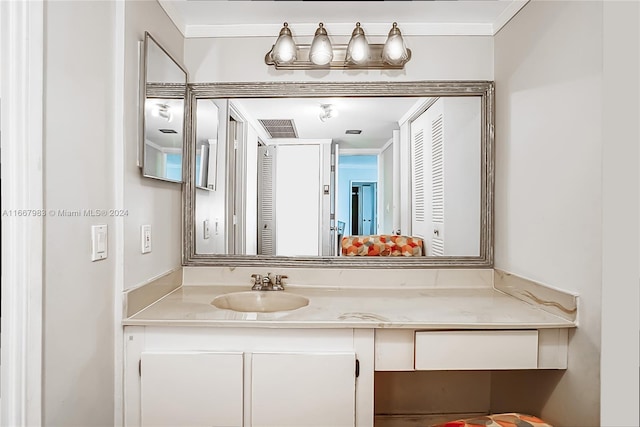 bathroom with vanity and crown molding