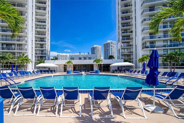 view of swimming pool with pool water feature