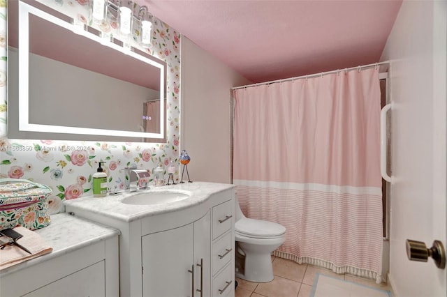 bathroom featuring curtained shower, vanity, toilet, and tile patterned floors