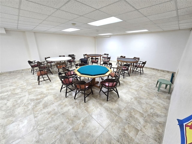 dining room featuring a drop ceiling