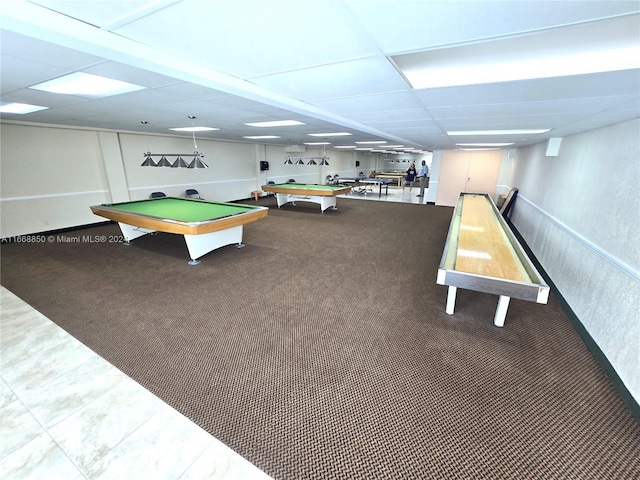 game room with pool table, a paneled ceiling, and carpet flooring