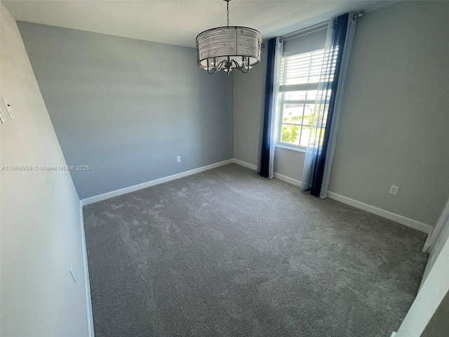 unfurnished room with baseboards, a notable chandelier, and carpet floors