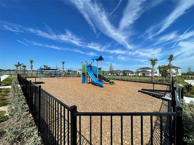 communal playground featuring fence