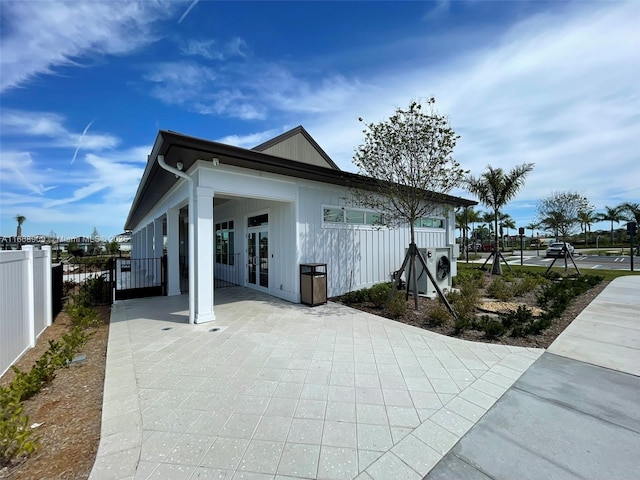 view of home's exterior featuring fence