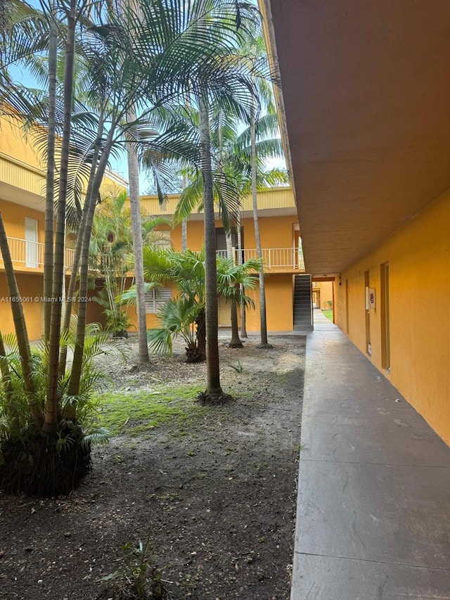 view of yard with a balcony