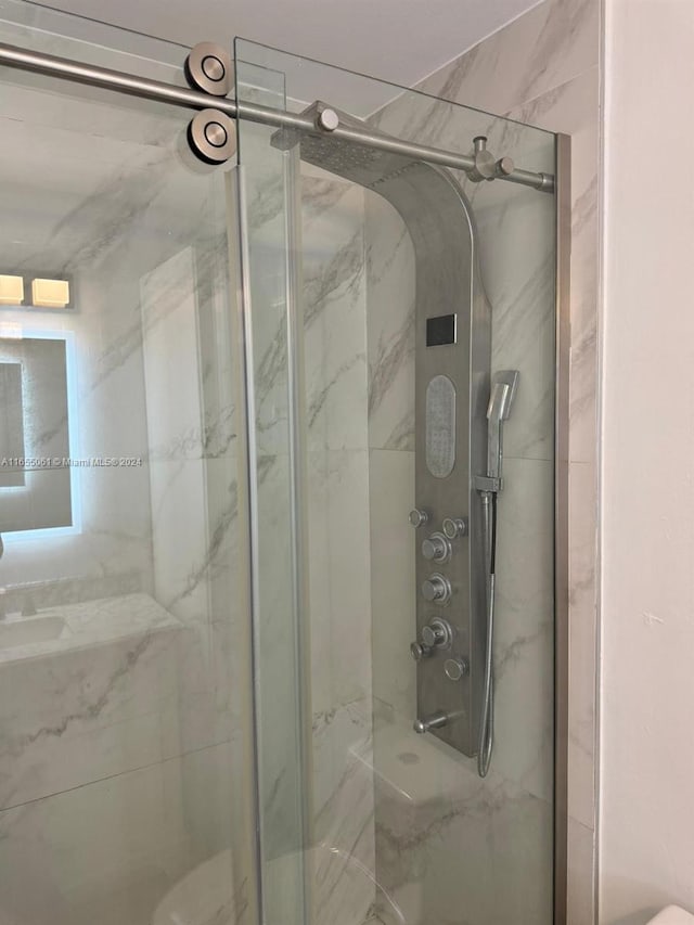 bathroom with an enclosed shower