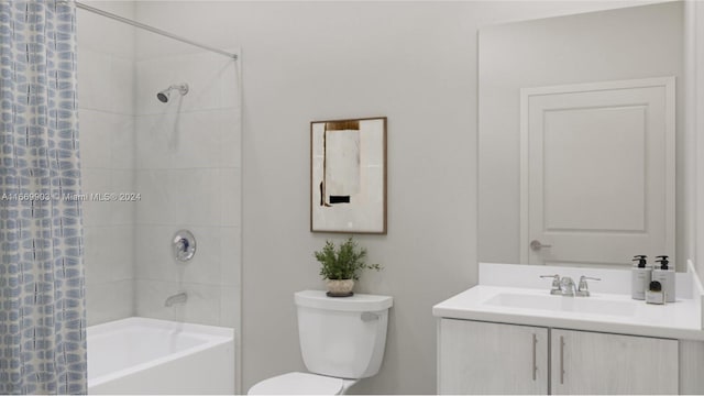 full bathroom featuring vanity, toilet, and shower / tub combo