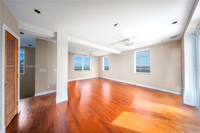 unfurnished room featuring hardwood / wood-style floors and ceiling fan