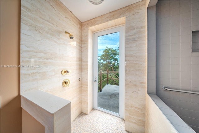 bathroom featuring tile walls