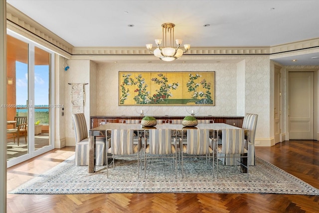 dining area with parquet flooring and an inviting chandelier