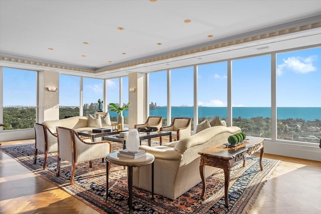 sunroom / solarium featuring a water view