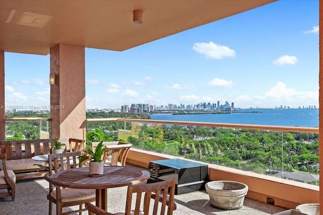 balcony featuring a water view