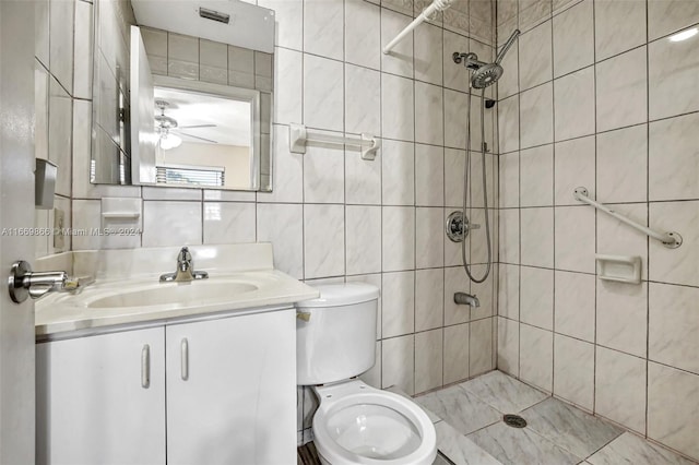 bathroom with vanity, backsplash, a tile shower, tile walls, and toilet