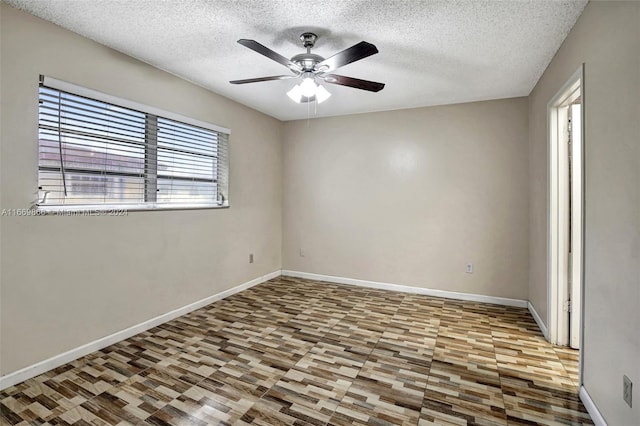 unfurnished room with ceiling fan, hardwood / wood-style floors, and a textured ceiling