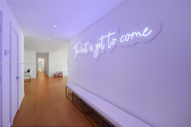 corridor featuring hardwood / wood-style floors