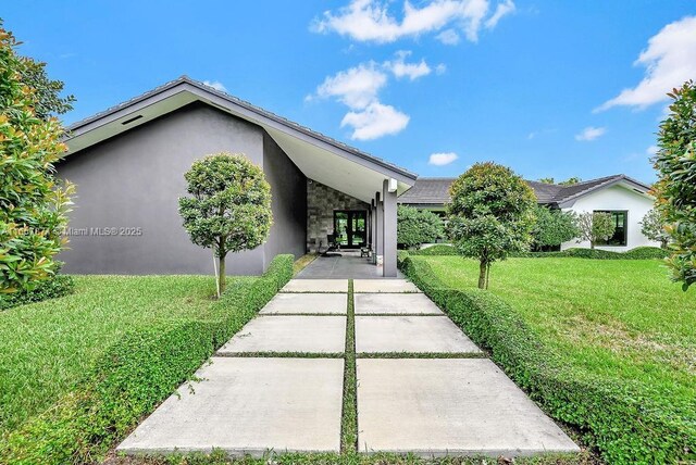 view of front of house with a front lawn