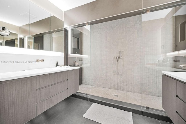 bathroom featuring vanity and tiled shower