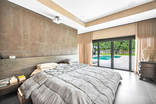 bedroom with access to exterior and concrete flooring