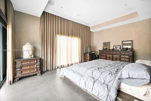 bedroom featuring concrete flooring