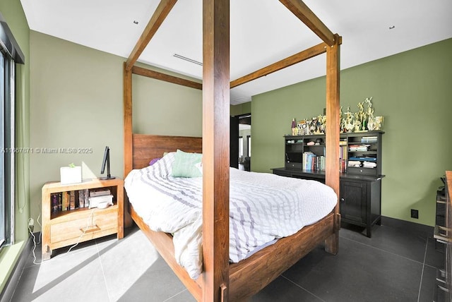 tiled bedroom with beam ceiling