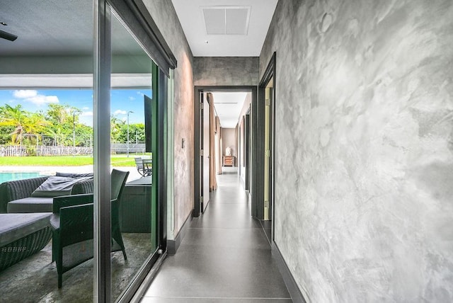 hallway with concrete floors