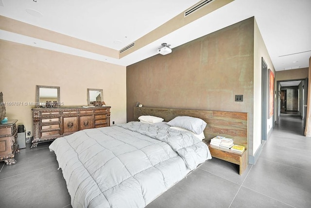 bedroom featuring concrete floors