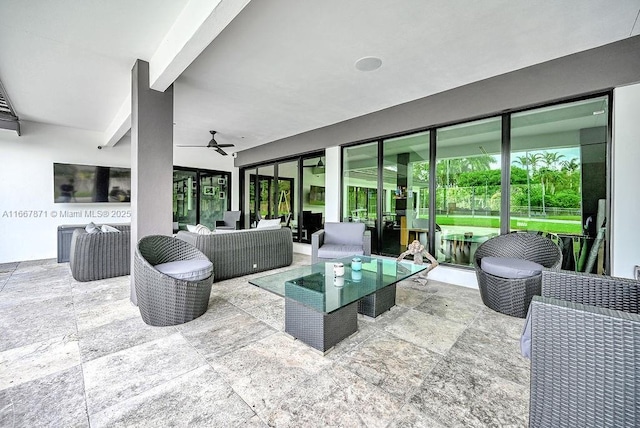 view of patio with ceiling fan and an outdoor living space