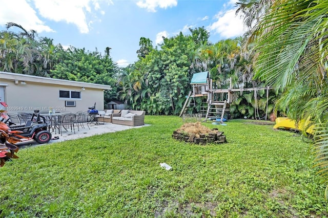 view of yard with outdoor lounge area and a patio