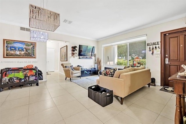living room featuring visible vents, light tile patterned floors, and crown molding