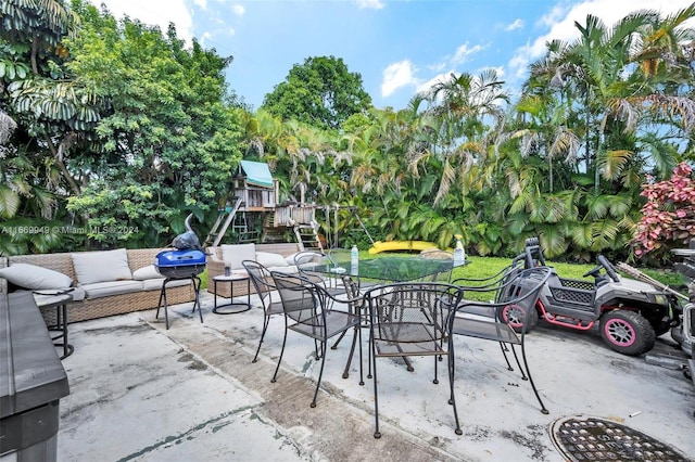 view of patio featuring an outdoor hangout area and a playground