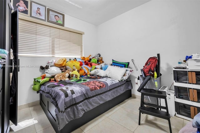 bedroom with light tile patterned floors