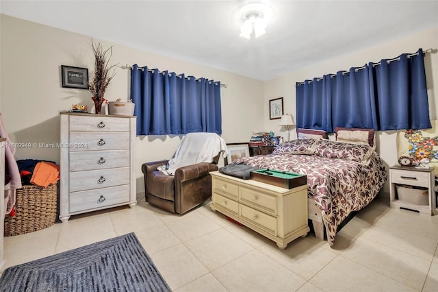 bedroom featuring light tile patterned flooring