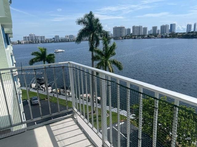 balcony featuring a water view