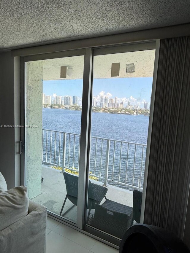 balcony featuring a water view