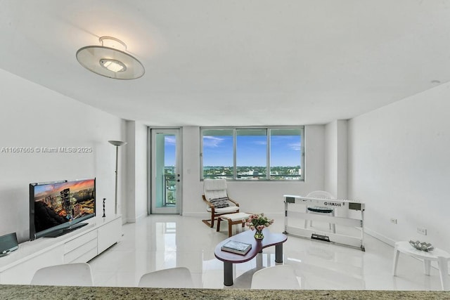 tiled living area with baseboards