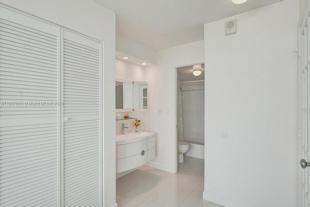 bathroom with tile patterned floors, a closet, vanity, shower / tub combination, and toilet