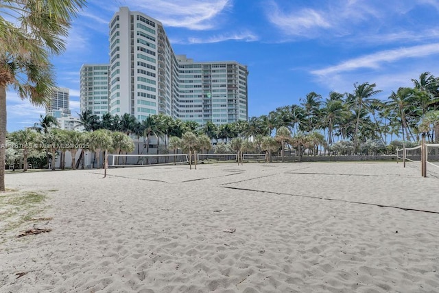 view of home's community featuring volleyball court
