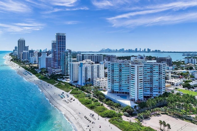 bird's eye view with a beach view, a water view, and a view of city