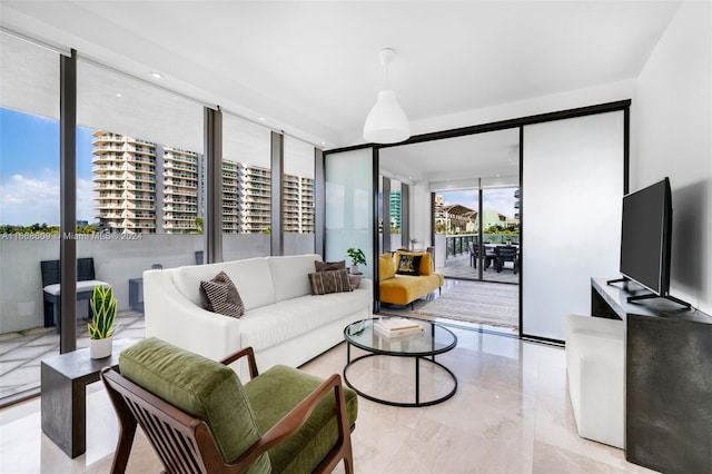 living room with expansive windows and plenty of natural light