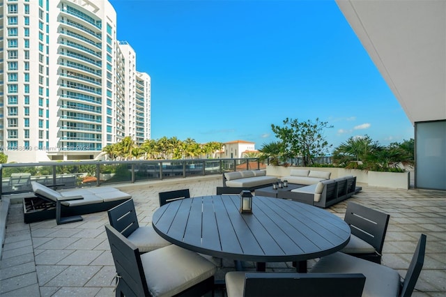 view of patio featuring a balcony and an outdoor hangout area