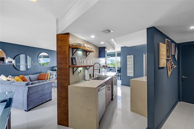 kitchen with light tile patterned floors, dishwasher, sink, and exhaust hood