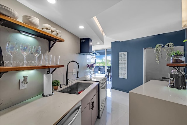 kitchen with light stone counters, sink, wall chimney exhaust hood, appliances with stainless steel finishes, and light tile patterned floors