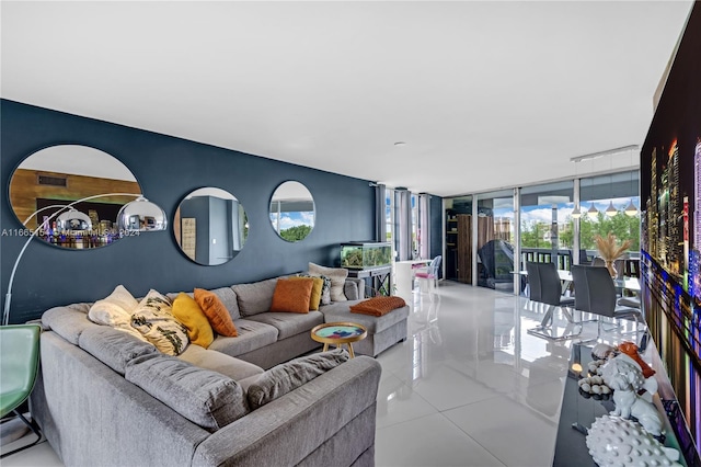 tiled living room featuring expansive windows