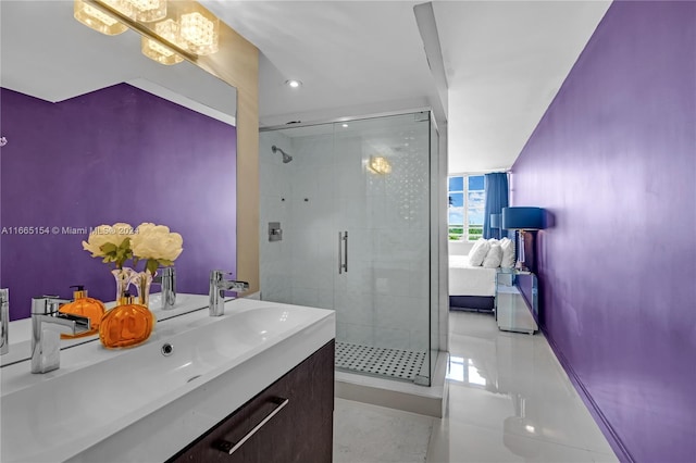 bathroom featuring vanity, tile patterned floors, and a shower with shower door