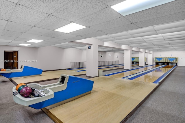 recreation room featuring a drop ceiling