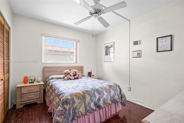 bedroom featuring a closet, ceiling fan, and dark hardwood / wood-style floors