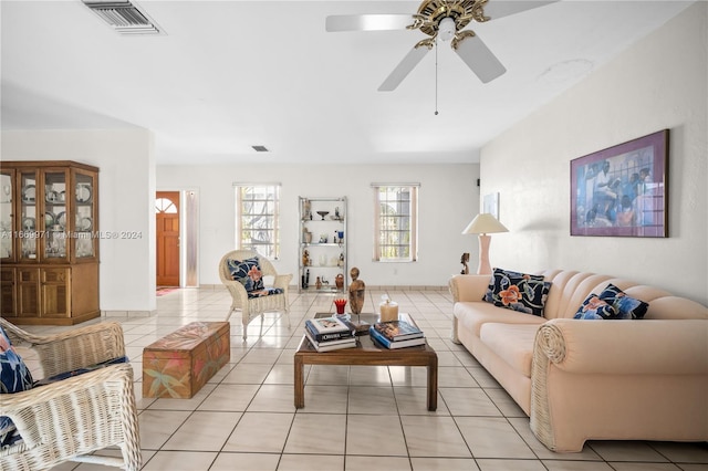 living room featuring ceiling fan and light tile patterned floors