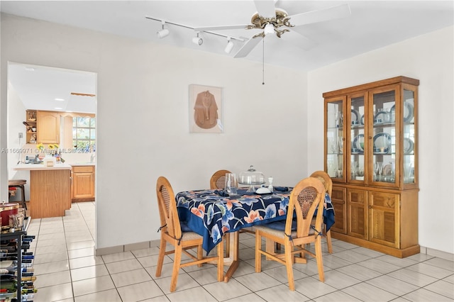 tiled dining room with ceiling fan